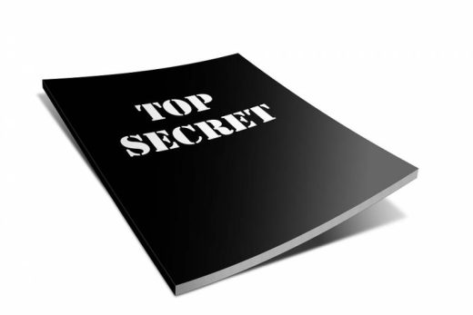 Dossier noir "TOP SECRET" posé sur fond clair, ambiance mystérieuse façon escape game Laeris Toulon.